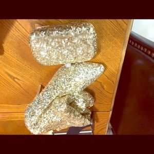 Gold sequined stretched boots and matching clutch